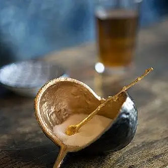 BROWN AND GOLD POD BOWL WITH ONE 4" GOLD SPOON